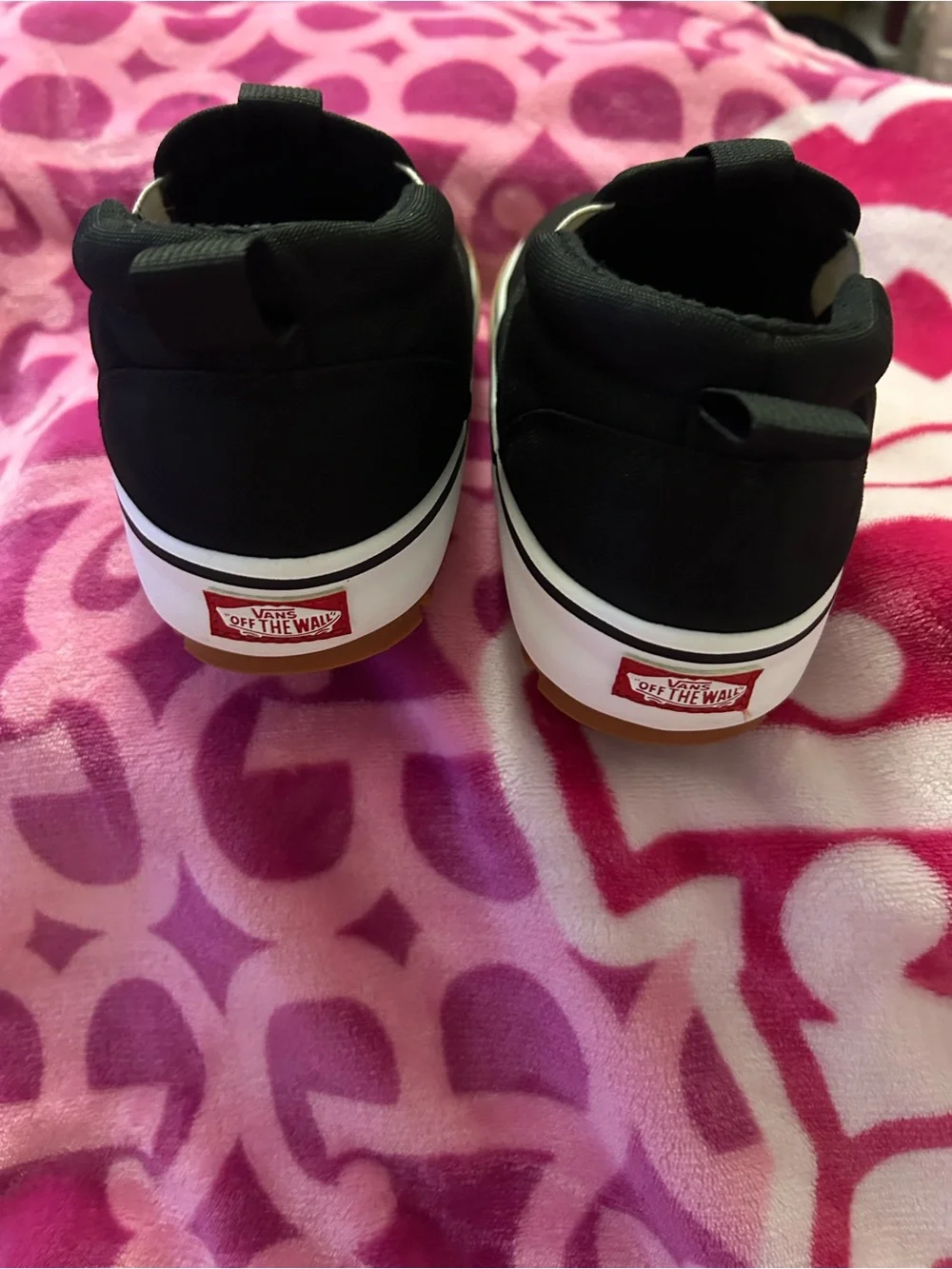 Vans Black Slip-On Sneakers with White Midsole and Gum Outsole
